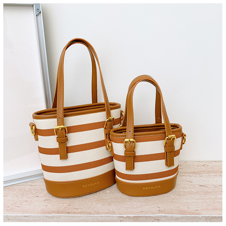Csíkos színblokkal készült bucket táska, crossbody vállpánttal, mindennapi stílusú nőknek és gyerekeknek
