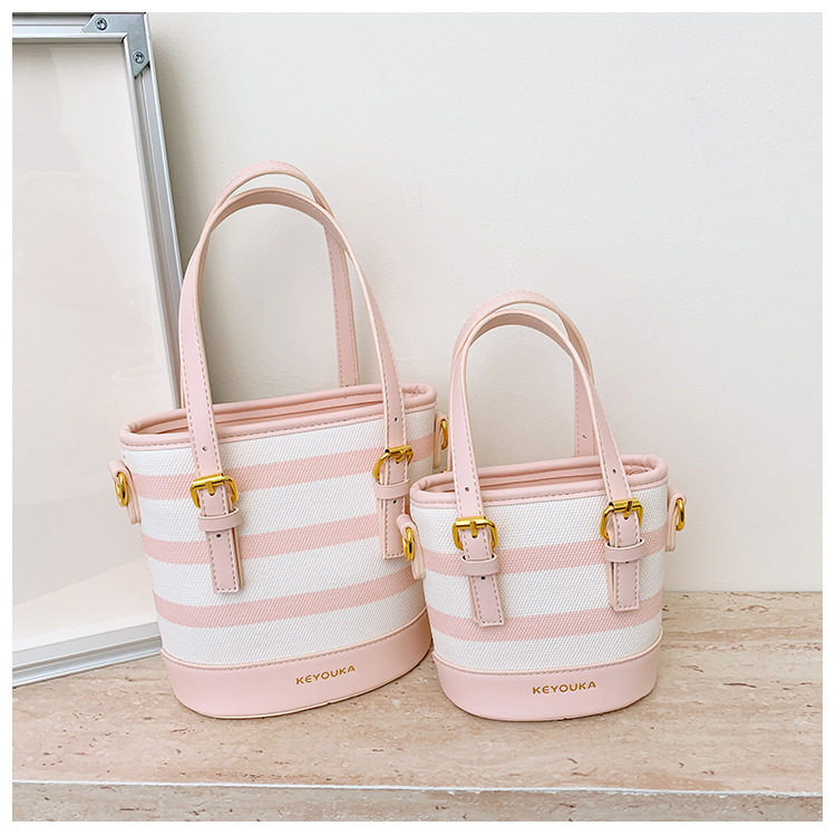 Csíkos színblokkal készült bucket táska, crossbody vállpánttal, mindennapi stílusú nőknek és gyerekeknek