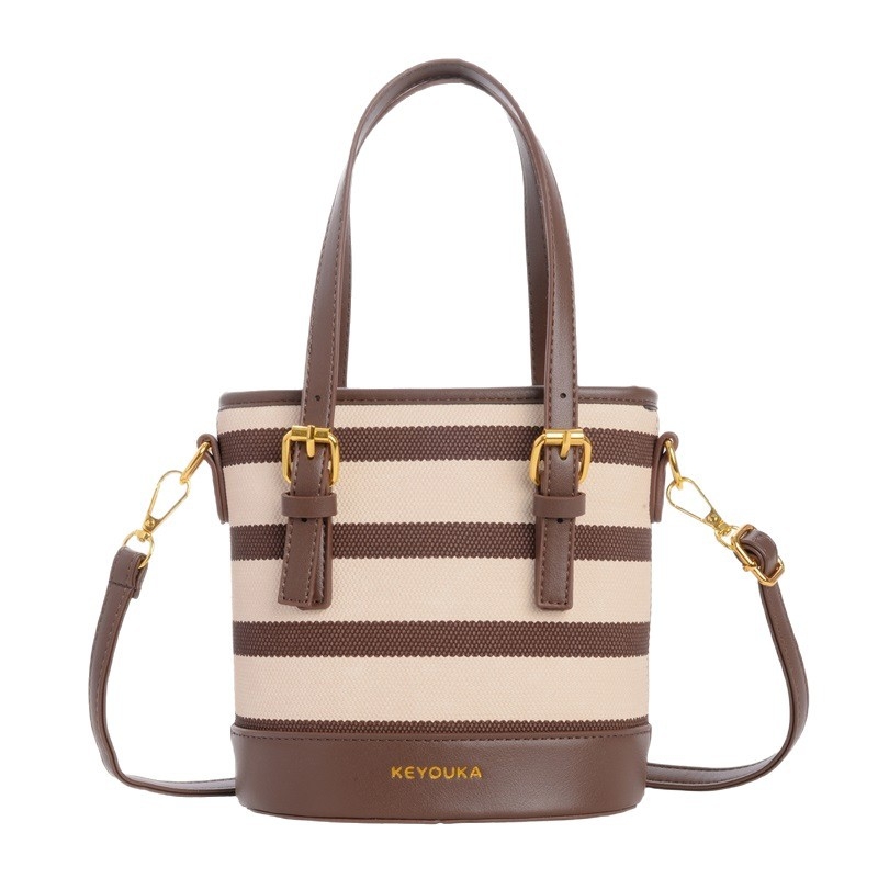 Csíkos színblokkal készült bucket táska, crossbody vállpánttal, mindennapi stílusú nőknek és gyerekeknek