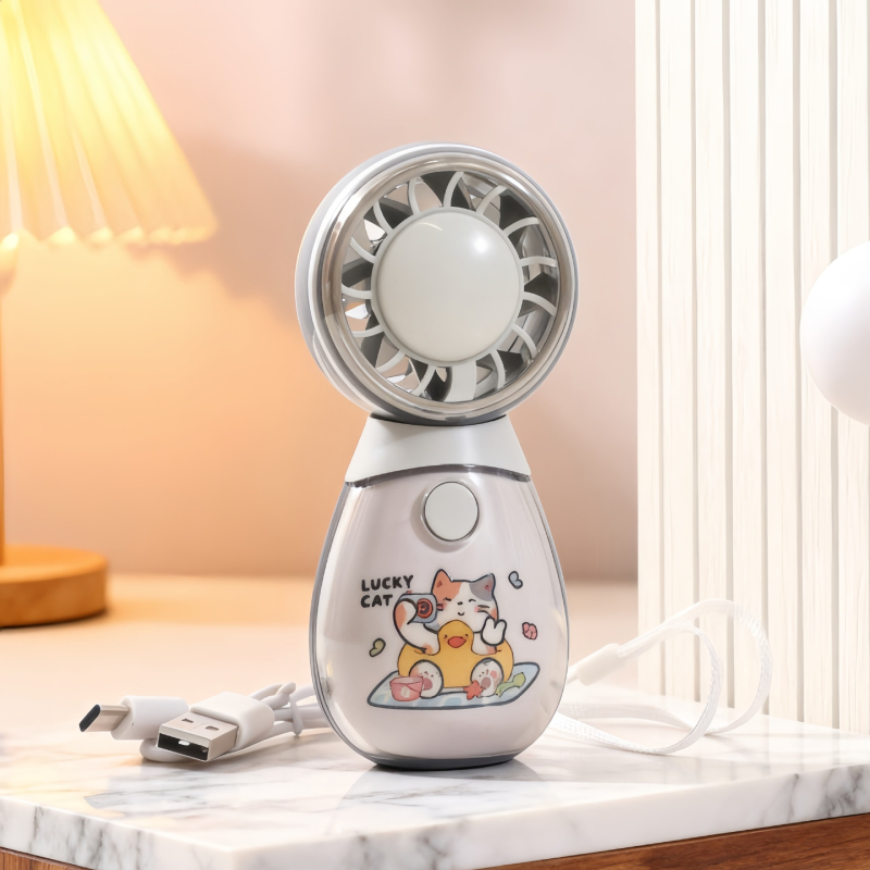 Roztomilý ručný mini ventilátor s tromi rýchlosťami a okrúhlym dizajnom v tvare domáceho maznáčika, ktorý sa dá nabíjať cez USB.