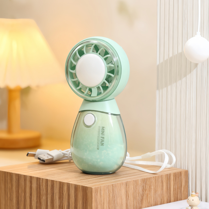 Roztomilý ručný mini ventilátor s tromi rýchlosťami a okrúhlym dizajnom v tvare domáceho maznáčika, ktorý sa dá nabíjať cez USB.