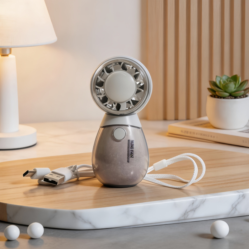 Roztomilý ručný mini ventilátor s tromi rýchlosťami a okrúhlym dizajnom v tvare domáceho maznáčika, ktorý sa dá nabíjať cez USB.