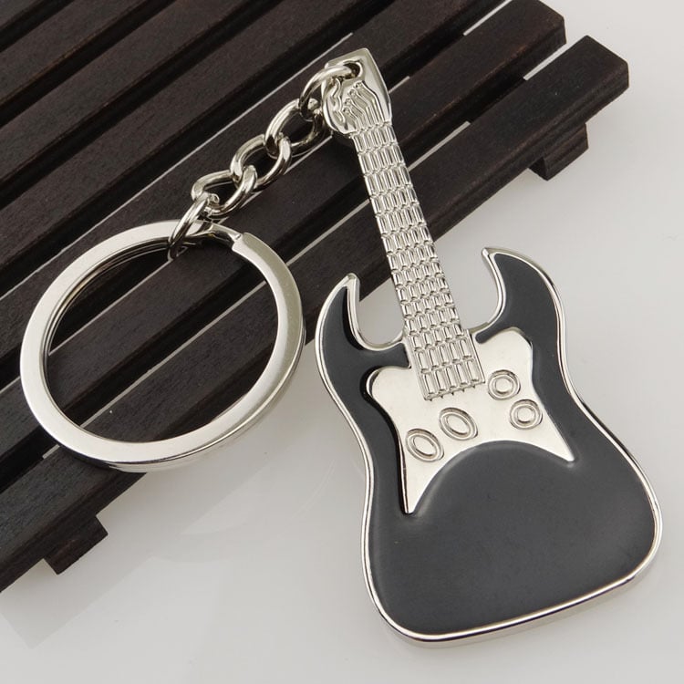 Breloc metal cu notă muzicală – design modern, cadou elegant