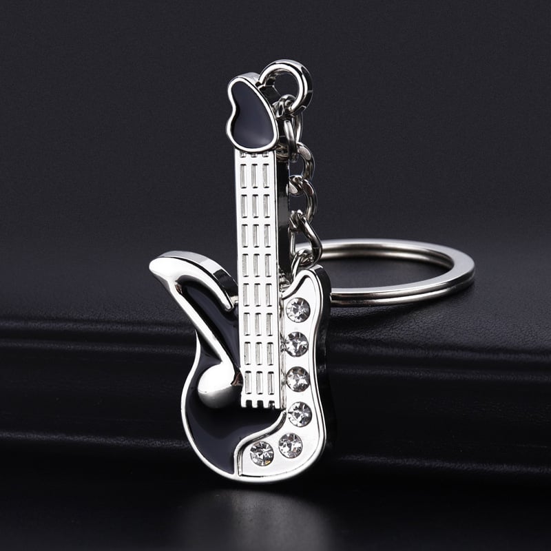 Breloc metal cu notă muzicală – design modern, cadou elegant