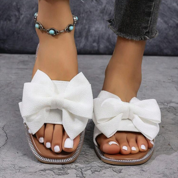 Női slip-on papucs masnival, textil felsőrész, négyzetes orr, lapos talp