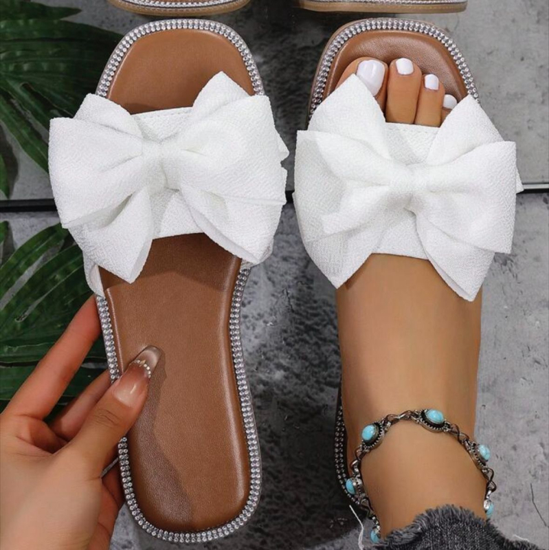 Női slip-on papucs masnival, textil felsőrész, négyzetes orr, lapos talp