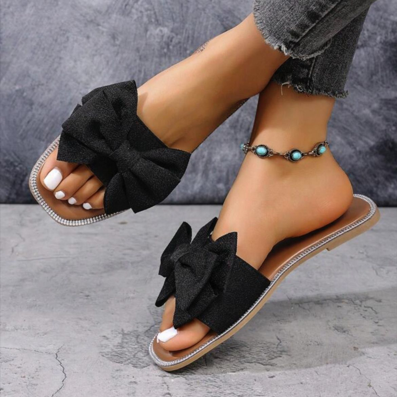 Női slip-on papucs masnival, textil felsőrész, négyzetes orr, lapos talp