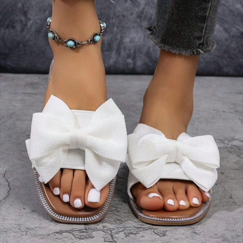 Női slip-on papucs masnival, textil felsőrész, négyzetes orr, lapos talp