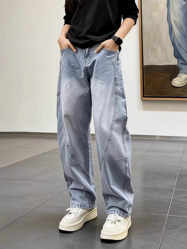 Blugi denim albastru spălat pentru bărbați, croială slim, tiv curbat, stil primăvară casual.