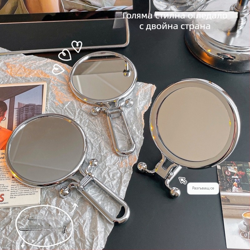 Козметично огледало, двустранно, сгъваемо, преносимо — за ръчно и настолно използване; ABS рамка, сребърно огледало.