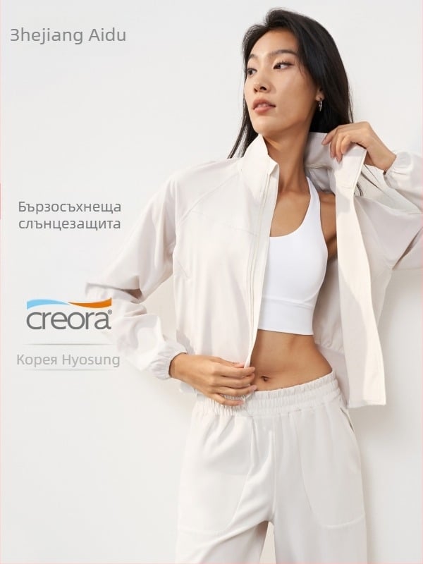 Слънцезащитно спортно яке за йога, тъкан плат, 91% полиестер и 9% еластан; дълги ръкави; свободна кройка; стойков яка и преден цип; дължина до ханша.