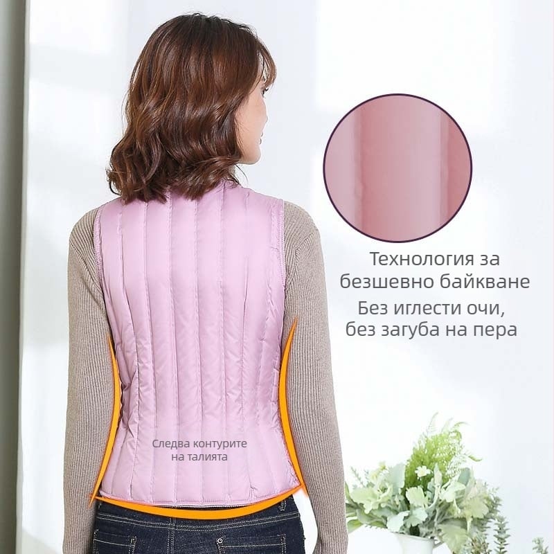 Дамска пухена жилетка, къса, Slim-fit, лека; пълнеж: пух от бяла утка; основен плат: полиестер 100%; подплата: полиестер; дължина 40–50 см; без яка; без ръкави