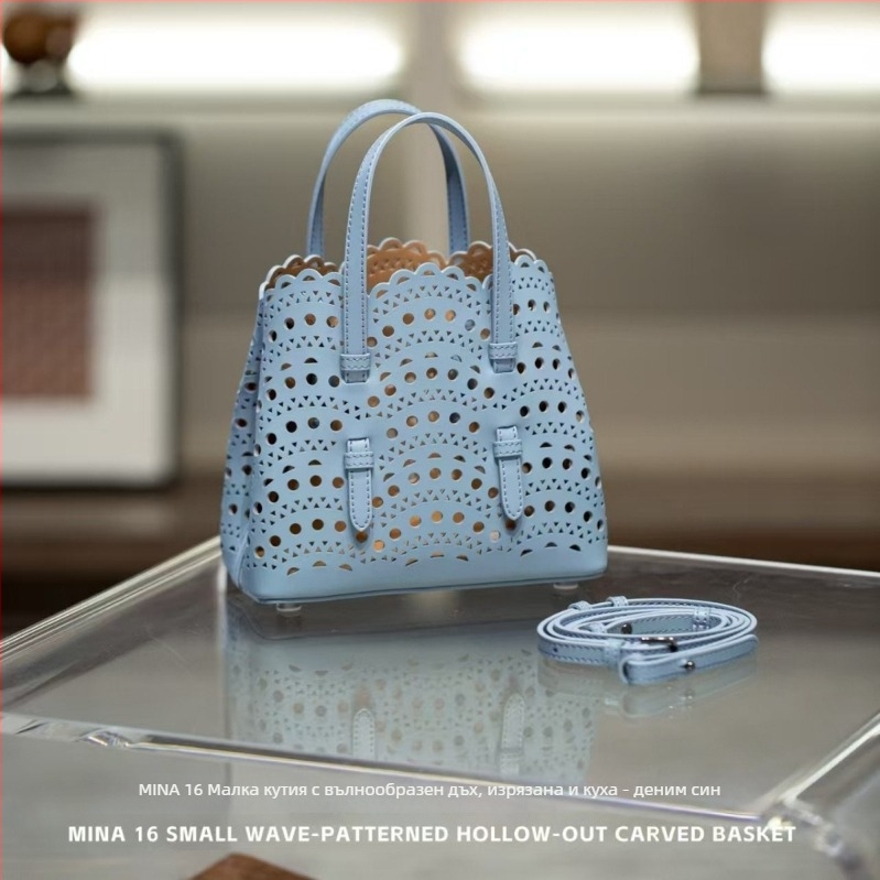 Чанта от естествена кожа кошничка с вълнообразна мрежеста резба и ажурни цветни мотиви, урбанистичен минималистичен стил, кръстосана презрамка, правоъгълна форма, джоб за телефон и джоб с цип, подплата полиестер