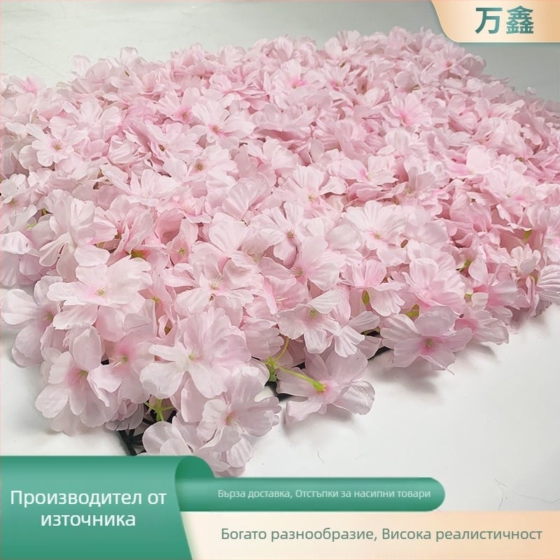 Сватбена цветна стена с изкуствени цветя: черешови цветове и хортензии върху плътен ред цветя за килим