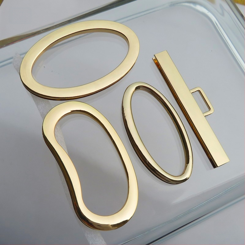 Metalo rankenos laikiklis – kiaušinio formos ovalas, tiesus strypas, didelis lankas