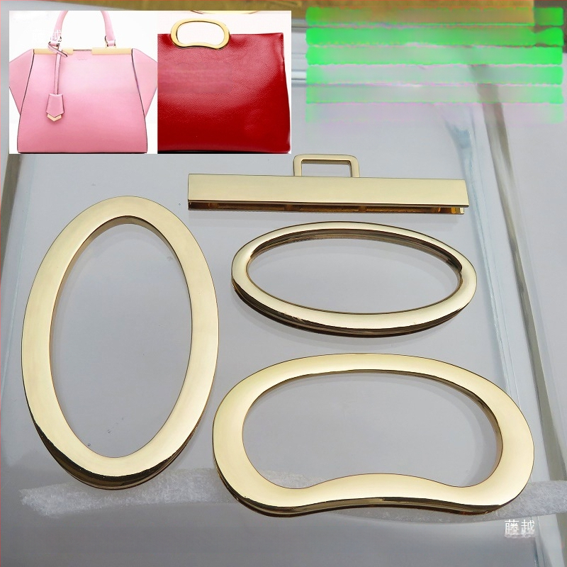 Metalo rankenos laikiklis – kiaušinio formos ovalas, tiesus strypas, didelis lankas