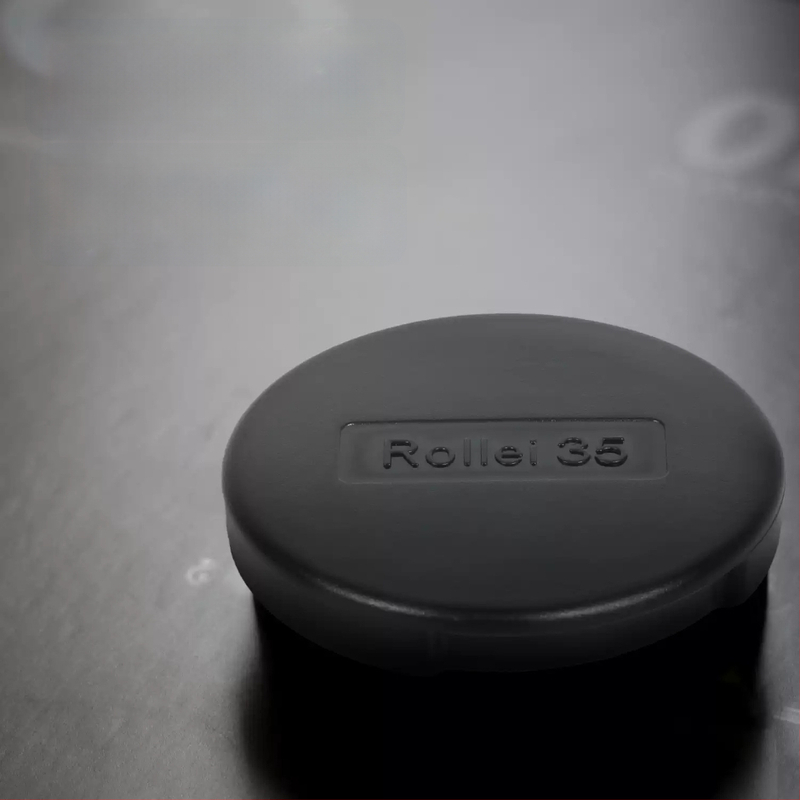 Rollei 35 objektyvo dangtelis Rolleiflex 35 serijai, bajonetas 30 mm, svoris 2,8 g, prekės kodas 53