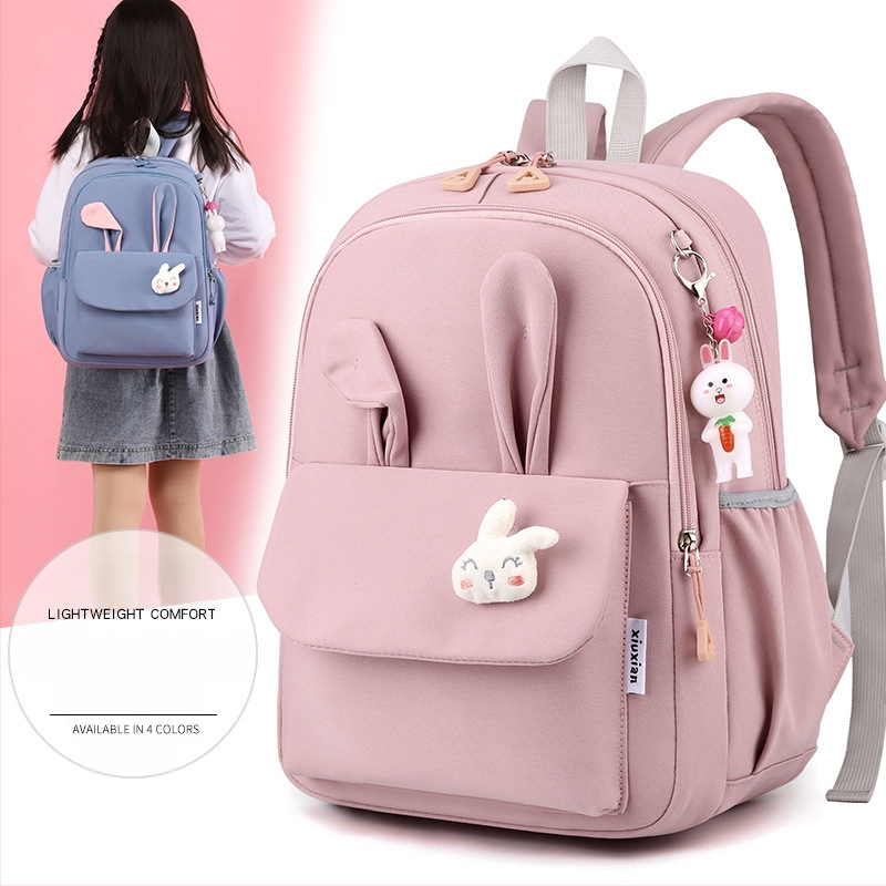 Mergaitėms skirta mokyklinė kuprinė iš nailono, vaikiško ir žaismingo stiliaus, skirta 1–2 klasei