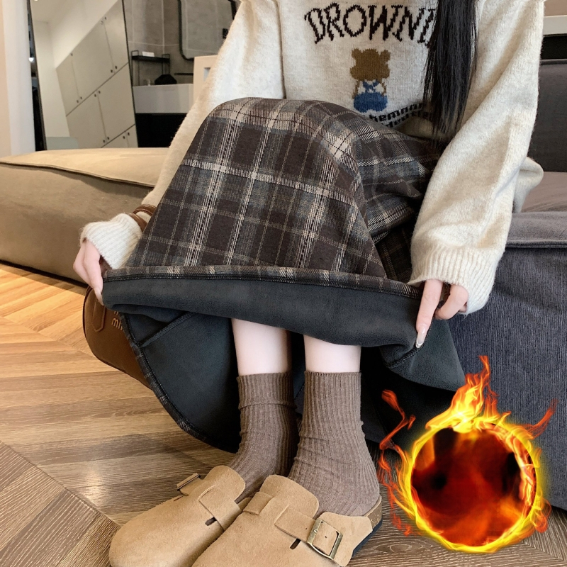 Ilgos vilnos sijonas su languotu raštu, platėjanti silueto linija, poliesterio-elastano mišinys (elastanas <30%), elastinga, ruduo 2025