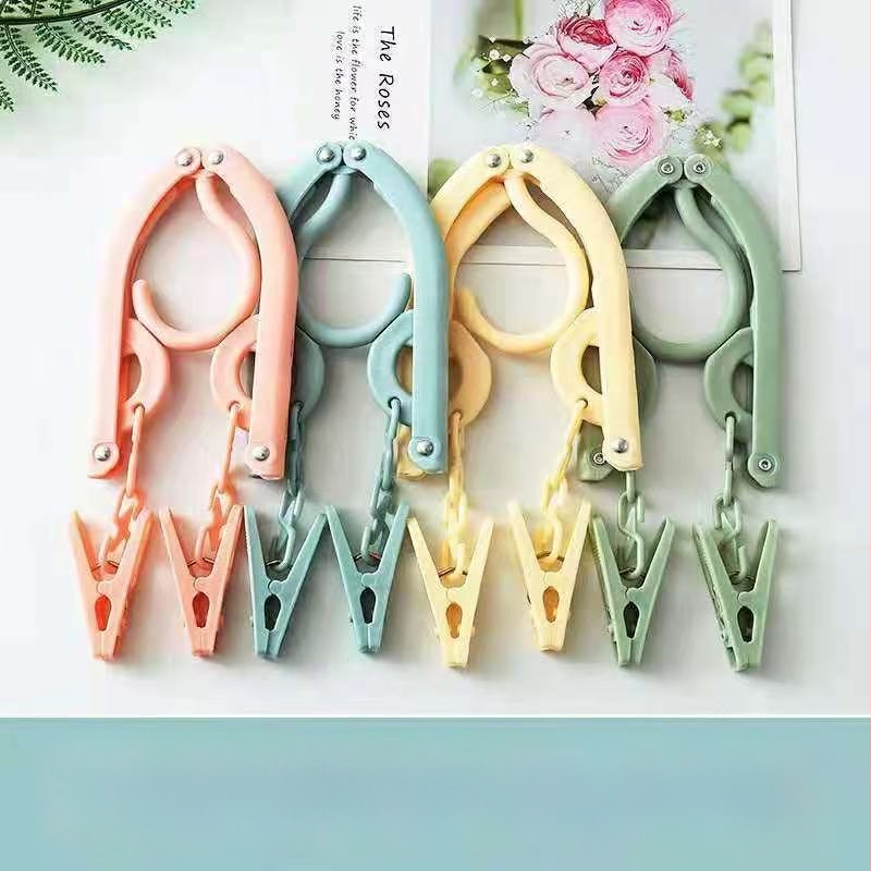 Ruhaakasztó klippel – teleszkópos, hordozható összecsukható ruhatartó (műanyag, 100% új anyag; ruhák, nadrágok és nyakkendők számára)