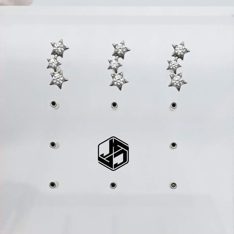 Обеци за ухо: звездообразни, унисекс; титанов сплав имплантен клас (ASTM F-136); циркон бял; диамантно полирани