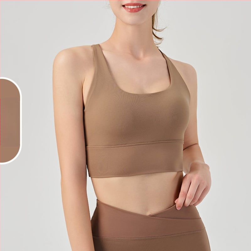Moterų jogos ir pilates sportinė liemenėlė su krūties pagalvėlėmis, drėgmę šalinantis audinys, nailonas 75%/spandeksas 25%, siauras kirpimas, liemens ilgis, rudens leidimas 2025