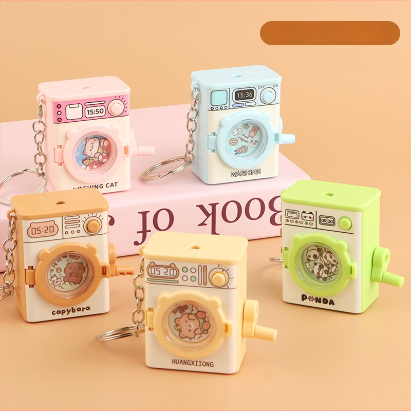 Atslēgu gredzens ar karikatūras veidolu veļasmaiņā, spīdīga plastmasas rotaļlieta, attīsta satvērienu un roku- acs koordināciju, bērniem vecumā 4–6 gadi