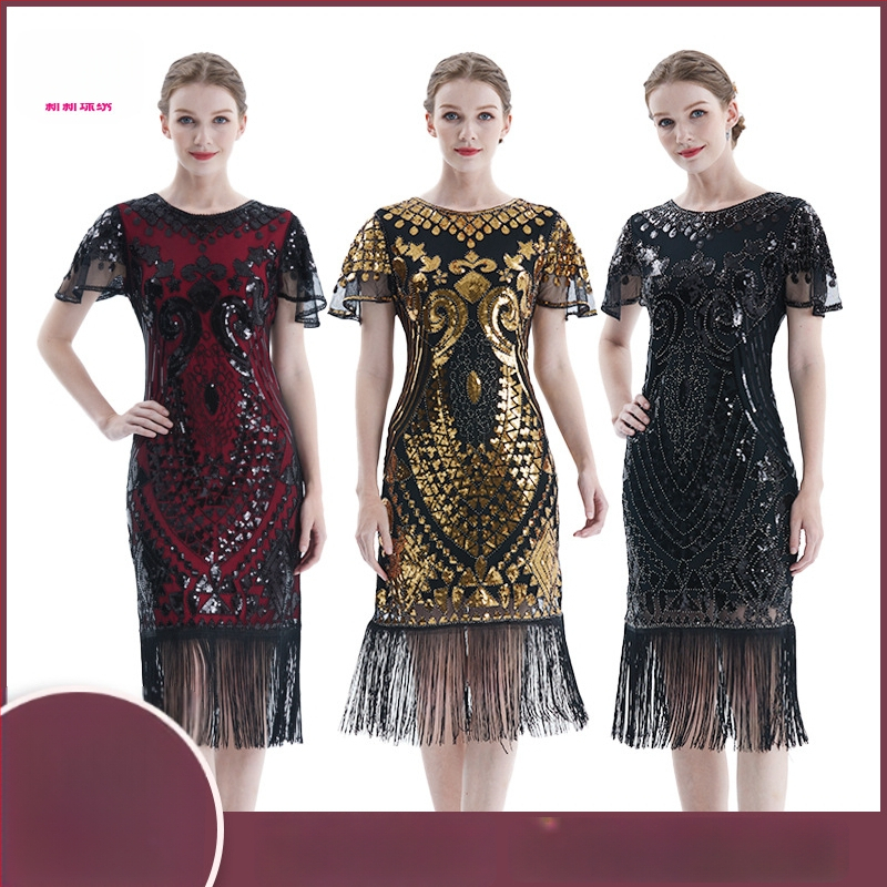 Рокля в стил Гатсби с мънисти и мрежест тъкан, къс ръкав, дълбоко V-деколте, пайети и ресни; полиестер/найлон смес, основна тъкан 50–70%, средна дължина на пола