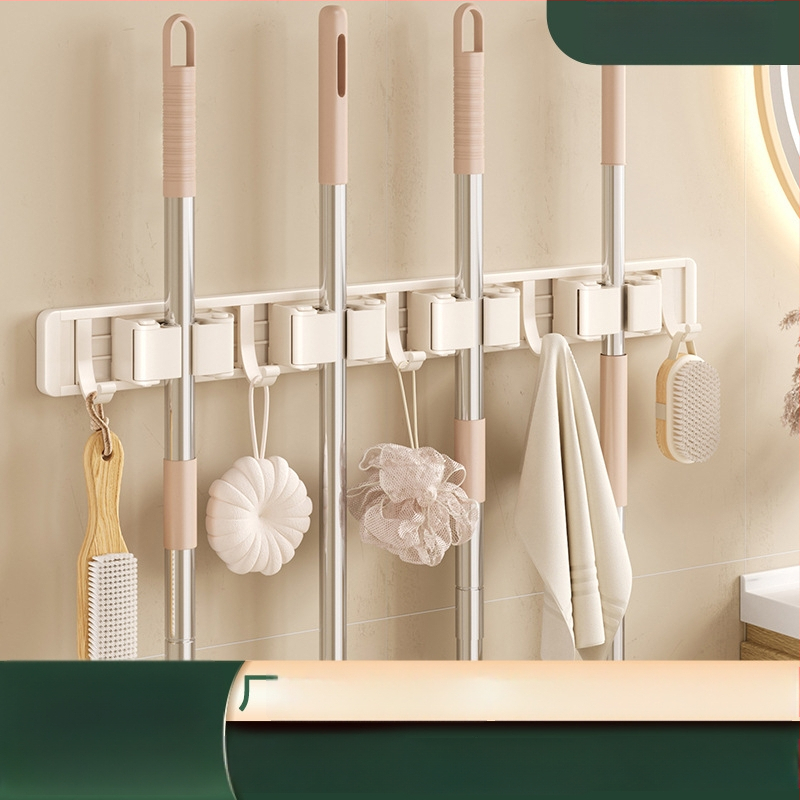 Stienā sienas plaukts mopam un slotai Crown Toon, materiāls: kosmiskais alumīnijs un plastmasa, uzstādīšana bez urbumiem, uzglabāšana mopas rokturiem, virsmas apdare: spreja plastmasa, svars 0,3 kg