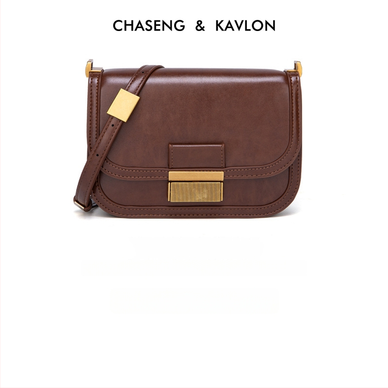 PU sieviešu crossbody soma - kvadrātvietas forma, aizdare ar sprādzi, iekšējie nodalījumi telefonam, personas apliecībai un rāvējslēdzēja kabata, regulējams siksnas garums