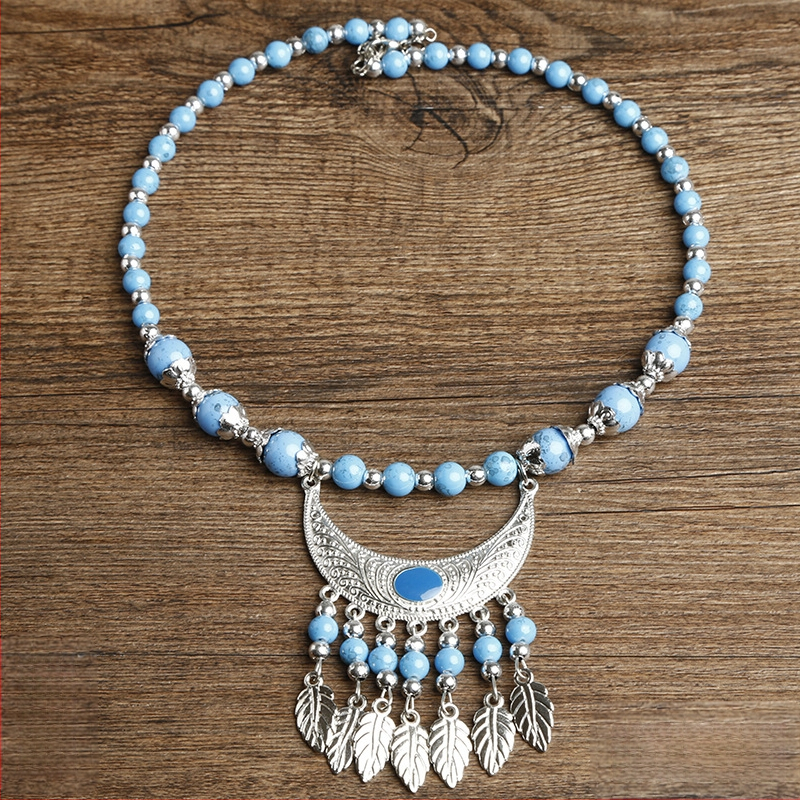 Etno stiiliga kaelakee lillekujundusega; materjalid: kangas ja segamaterjalid; bränd: Confucianism and Yixiang; päritolu: Yunnan