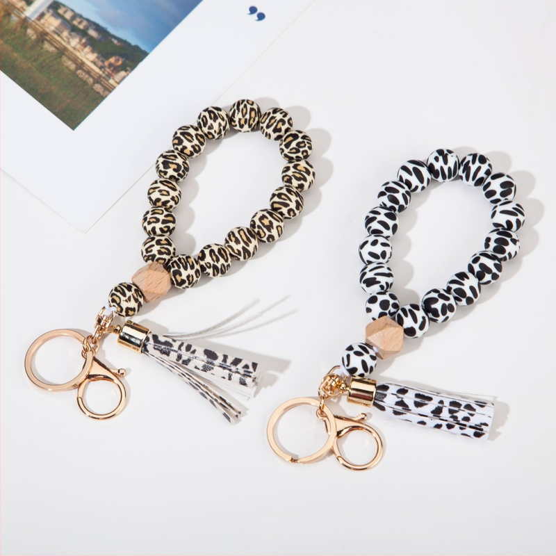 Silikona pirkstu rokassprādzes atslēgu piekariņš ar PU fiksu – leopardu raksts, dekoratīvs aksesuārs (Materiāls: Silikons; Stils: Dabas, Sievietes; Logo drukāšana: Iespējama; Forma: Cits; Funkcija: Dekorēšana)