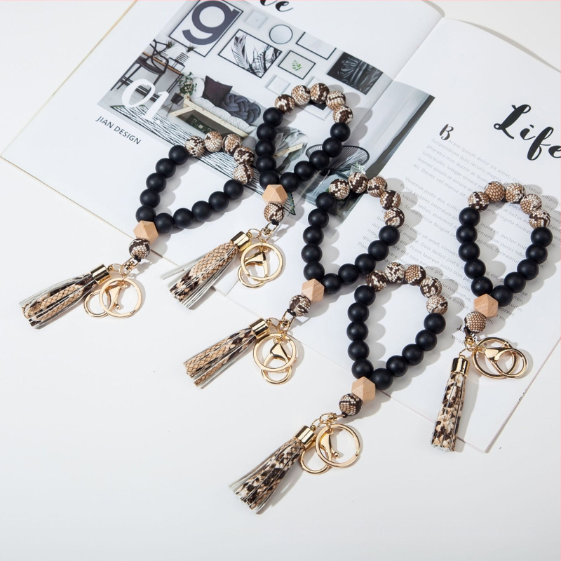 Silikona pirkstu rokassprādzes atslēgu piekariņš ar PU fiksu – leopardu raksts, dekoratīvs aksesuārs (Materiāls: Silikons; Stils: Dabas, Sievietes; Logo drukāšana: Iespējama; Forma: Cits; Funkcija: Dekorēšana)