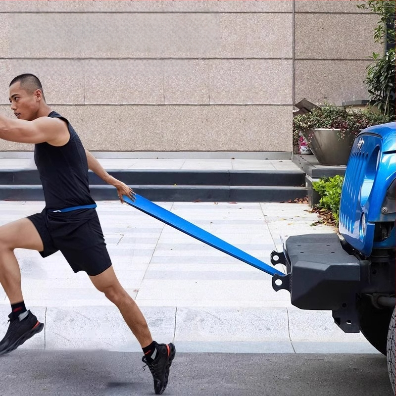 Elastīgā trenēšanās lenta ar palīdzības jostu, piemērota vilkšanai uz augšu (pull-ups), spēka treniņiem un izstiepšanai