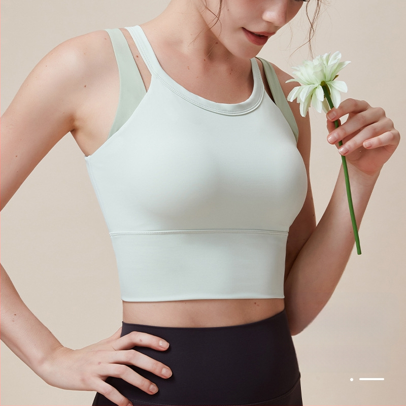 Joga krūšturis ar fiksētām kupām, glīts muguras dizains, cieša piegulšana; Materiāls: Nīlons 79% + Spandeks 21%; Audums: ķīmisko šķiedru maisījums; Garums: 40.5–41.7 cm