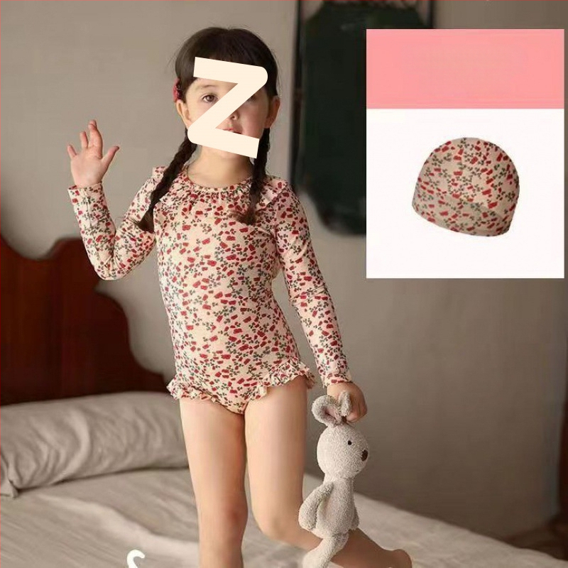 Mergaitėms: atviros nugaros viengabalis maudymosi kostiumėlis, karikatūrų raštas, amžius 0-8 metų, audinys: nailonas su elastanu