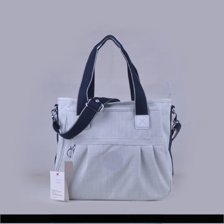 Õla kott crossbody – nailon, horisontaalne ruudu kuju, tõmblukukatte avamine, sisetaskud: tõmblukutasku, telefonitasku, ID-tasku, laminaat-tõmbluktasku, kaamera-tasku, vooder nailon