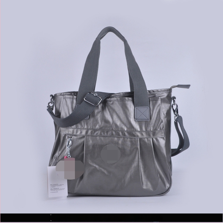 Õla kott crossbody – nailon, horisontaalne ruudu kuju, tõmblukukatte avamine, sisetaskud: tõmblukutasku, telefonitasku, ID-tasku, laminaat-tõmbluktasku, kaamera-tasku, vooder nailon