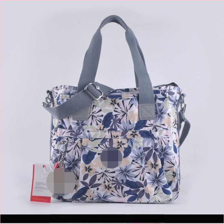 Õla kott crossbody – nailon, horisontaalne ruudu kuju, tõmblukukatte avamine, sisetaskud: tõmblukutasku, telefonitasku, ID-tasku, laminaat-tõmbluktasku, kaamera-tasku, vooder nailon