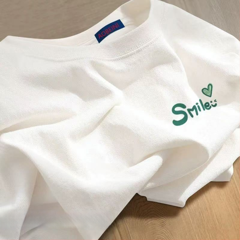 Sieviešu kokvilnas T-krekls ar apaļu kakla izgriezumu, īsiem piedurknēm, brīvā piegriezuma, ar teksta druku