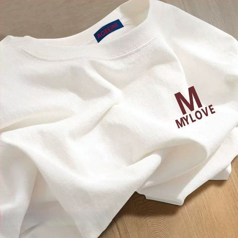 Sieviešu kokvilnas T-krekls ar apaļu kakla izgriezumu, īsiem piedurknēm, brīvā piegriezuma, ar teksta druku