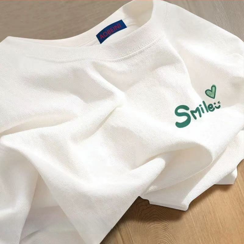 Sieviešu kokvilnas T-krekls ar apaļu kakla izgriezumu, īsiem piedurknēm, brīvā piegriezuma, ar teksta druku