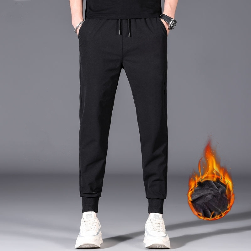 Flīša pildītas darba bikses ar brīvu piegriezumu, potītei aizsiets auklu, poliesteru audums