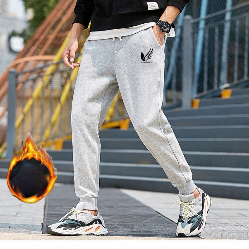 Flīša pildītas darba bikses ar brīvu piegriezumu, potītei aizsiets auklu, poliesteru audums