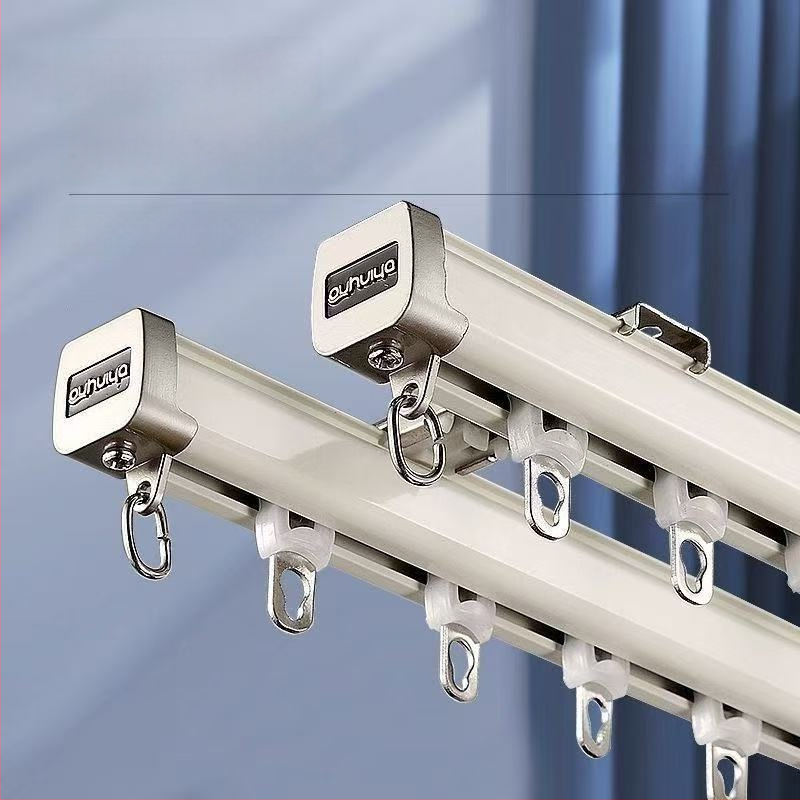 Huanli Užuolaidų bėgikliai – aliuminio lydinio, viršutinė ir šoninė montavimas, tylus bėgiklis su guoliais ratukais, skirtas vieno ir dviejų bėgiklių sistemai