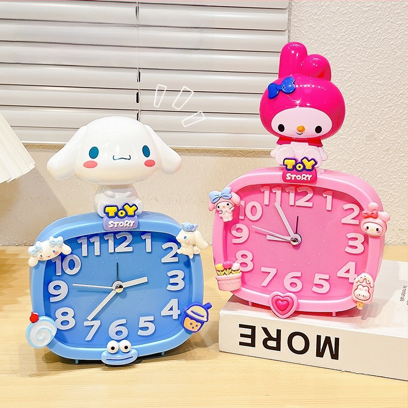 Bērniem paredzēts galda pulkstenis – karikatūru stilā, ar baterijām, izturīgs pret kritieniem (plastmasas korpuss, plastmasas cifernis)