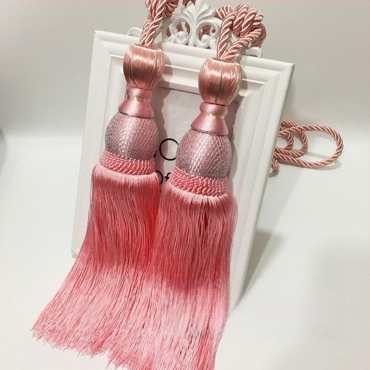 Aizkaru aukli - zelta stieples bumbiņa ar pušķi (audums)