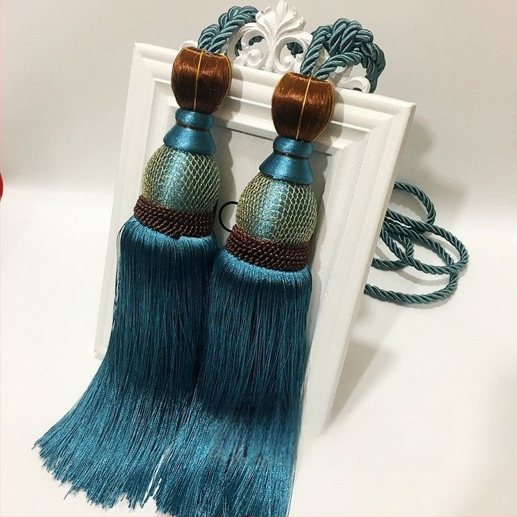 Aizkaru aukli - zelta stieples bumbiņa ar pušķi (audums)