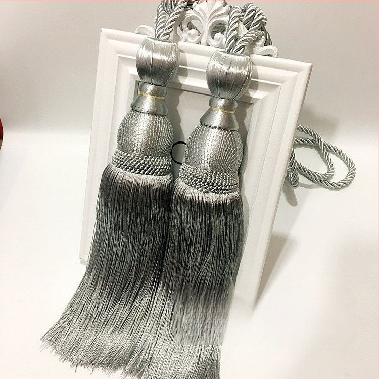 Aizkaru aukli - zelta stieples bumbiņa ar pušķi (audums)