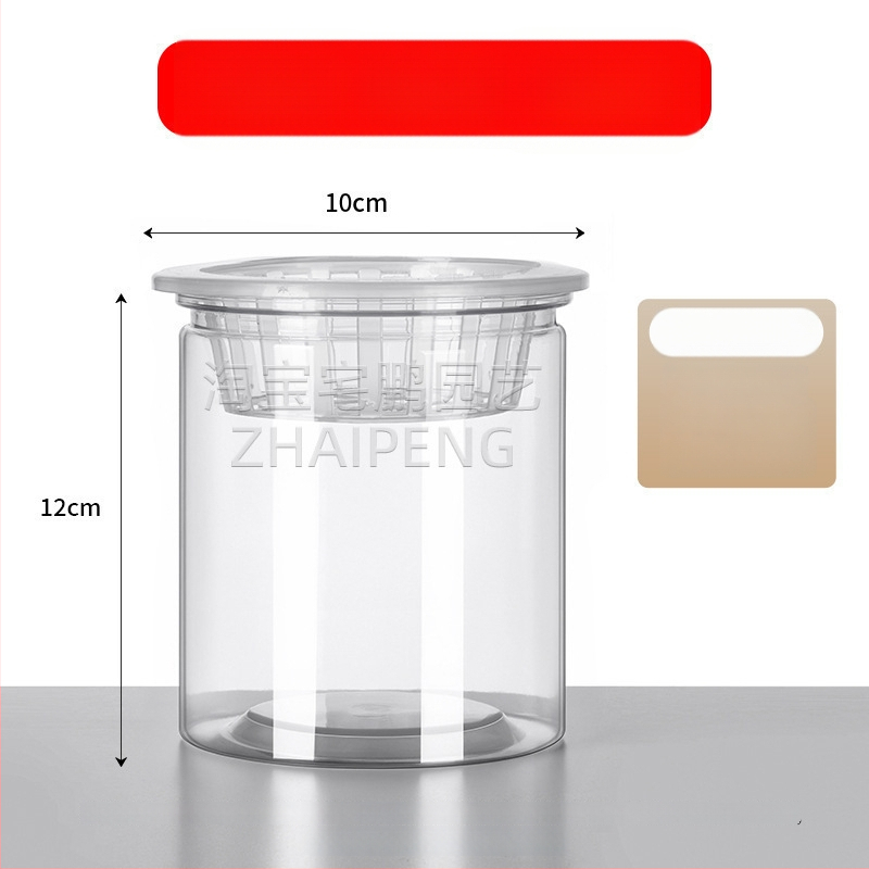 Caurspīdīgs plastmasas cilindrisks hydroponiskais pods sēklām un maziem augiem, stāvošs uz grīdas ar stādīšanas grozu, domāts mājas un dārza lietošanai